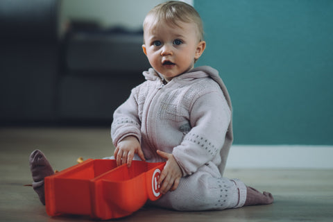 baby sitting on floor