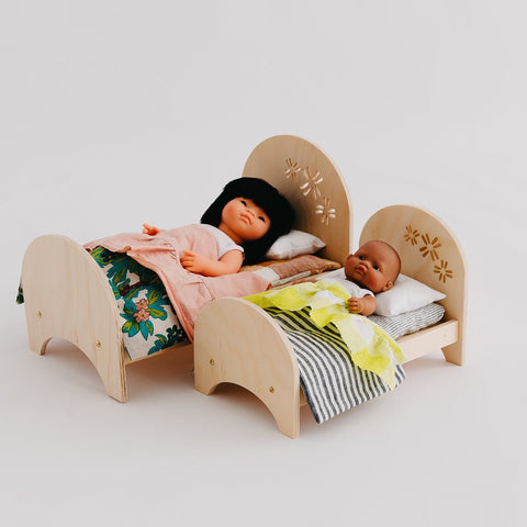 dolls in pine crafted beds
