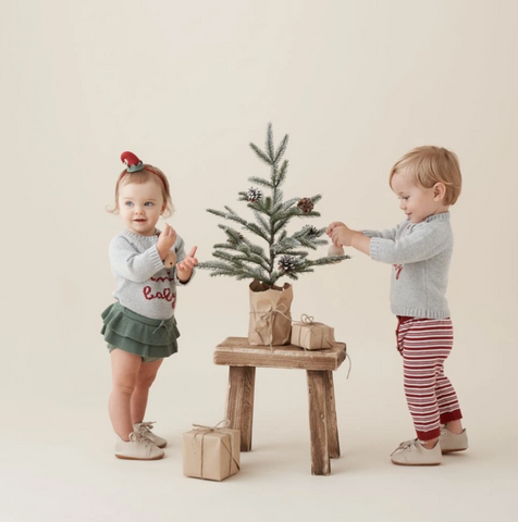 Toddler girl in "Santa Baby" Sweater Set and Toddler Boy in Knit Christmas sweater and leggings