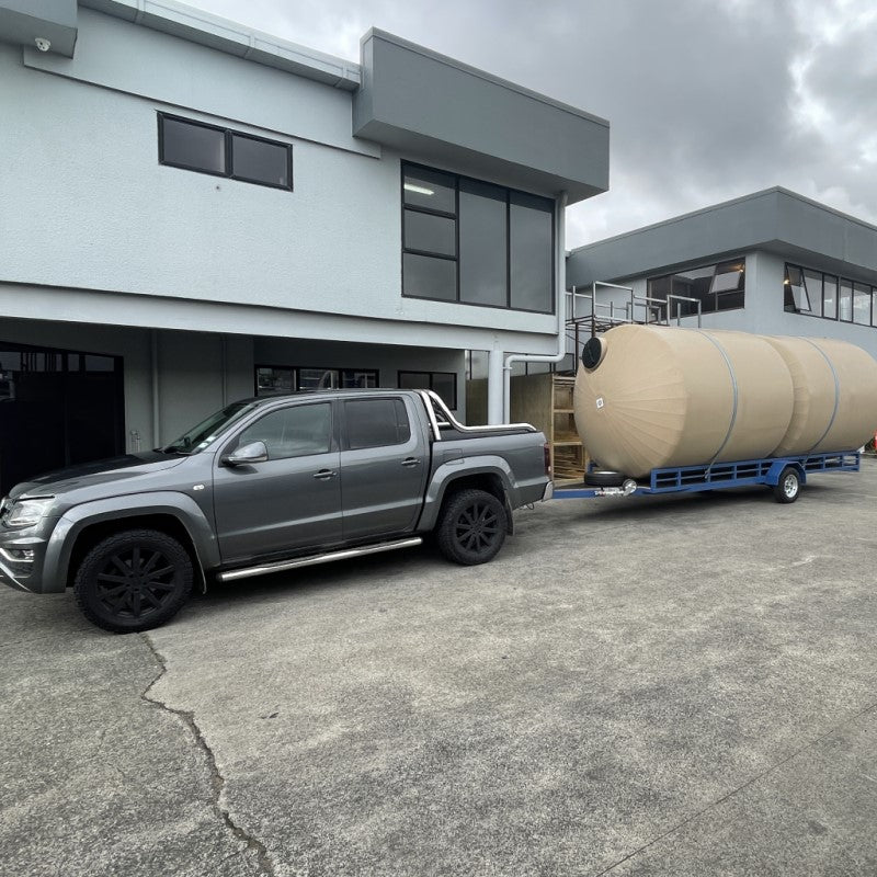 Beige 10000l Water Tanks being Deleivered