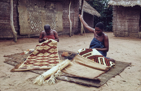 Kuba women decorating woven cloth in the Democratic Republic of the Congo, photographed in 1970. In the past, women were the main creators of the legendary Kuba textiles. Eliot Elisofon/Smithsonian Institution, National Museum of African Art