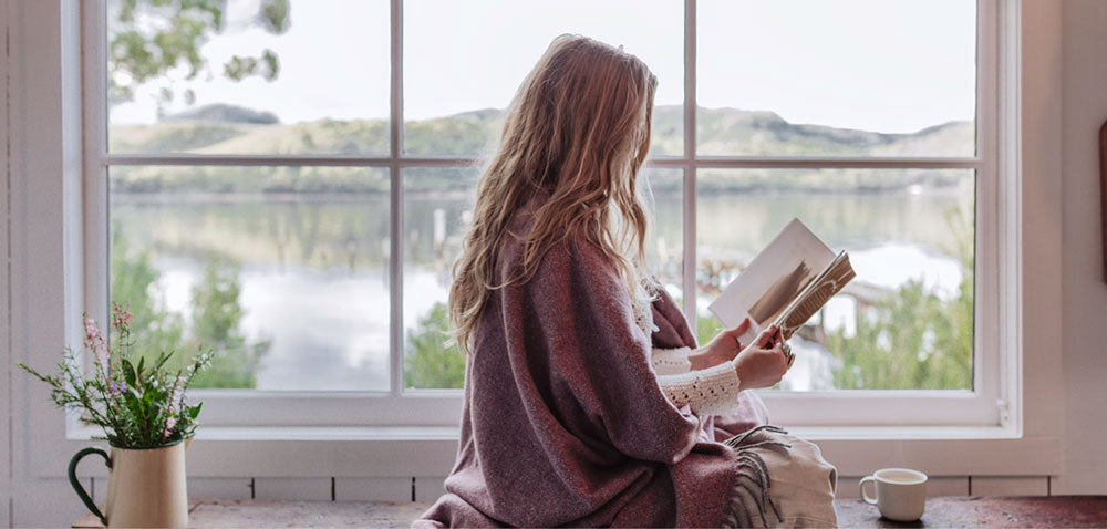 Our shack staples throw is perfect for a cosy afternoon with a book.