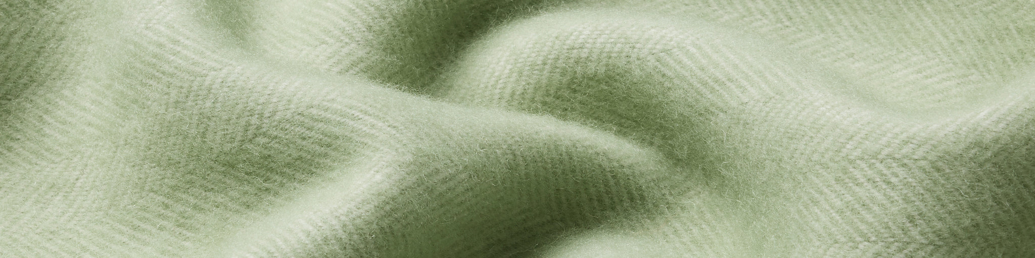Close up of herringbone weave in pale green