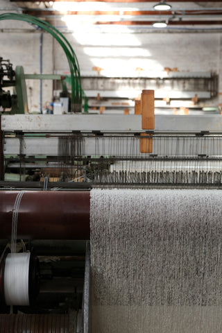 Natural Cooper's cormo on the loom.