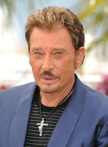 Johnny Hallyday et sa croix avec le guitariste crucifié