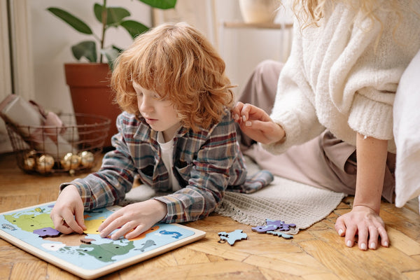 child solving puzzle