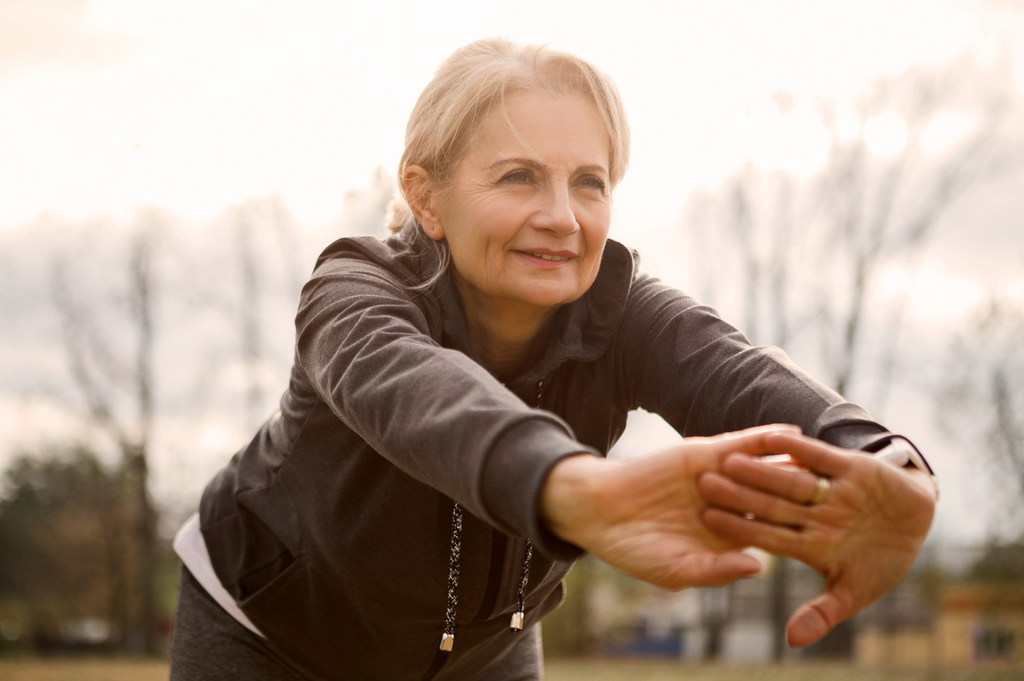 Mature woman exercising outdoors