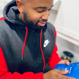 man looking down at his newly received mens refill pouch