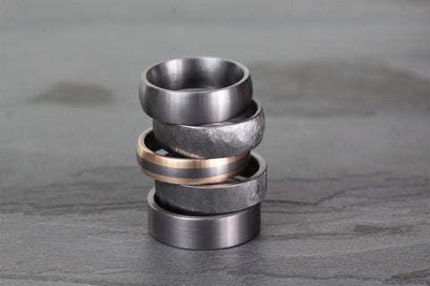 stack of tantalum and tantalum with rose gold wedding rings