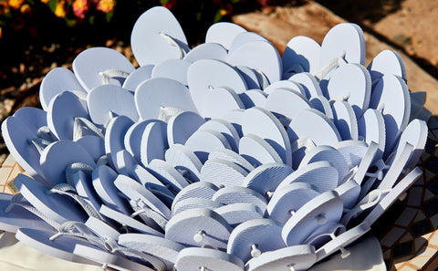 white flip flops arranged like a bouquet of flowers