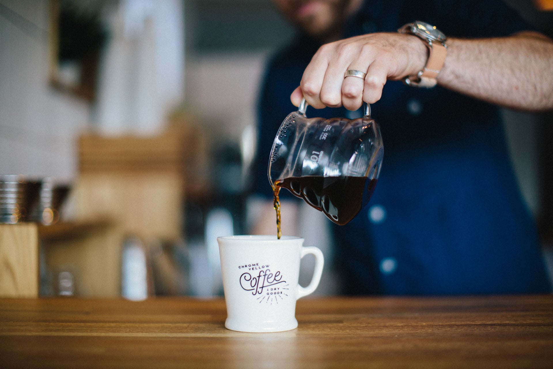 Coffee being poured into mug.