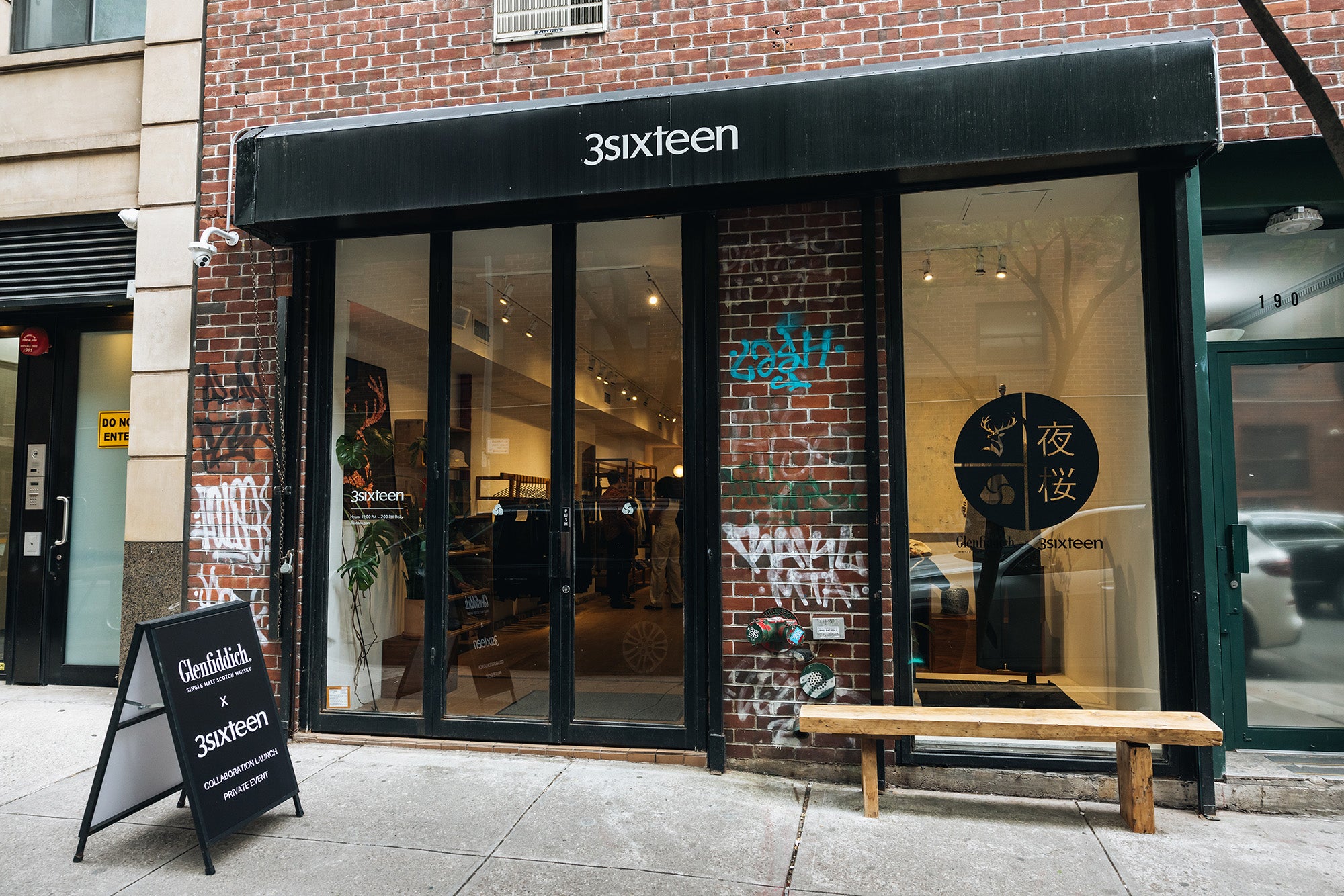 3sixteen's glass storefront featuring black window decals from Glenfiddich