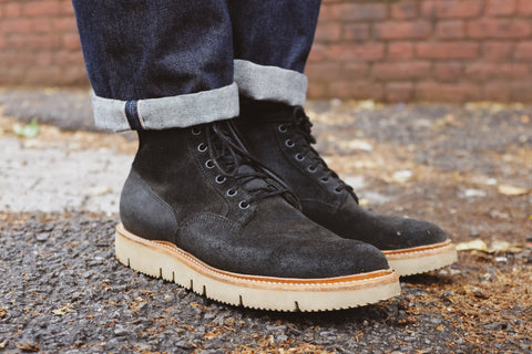 Chris' black Viberg Scout boots are paired with a high cuff on his 3sixteen jeans.