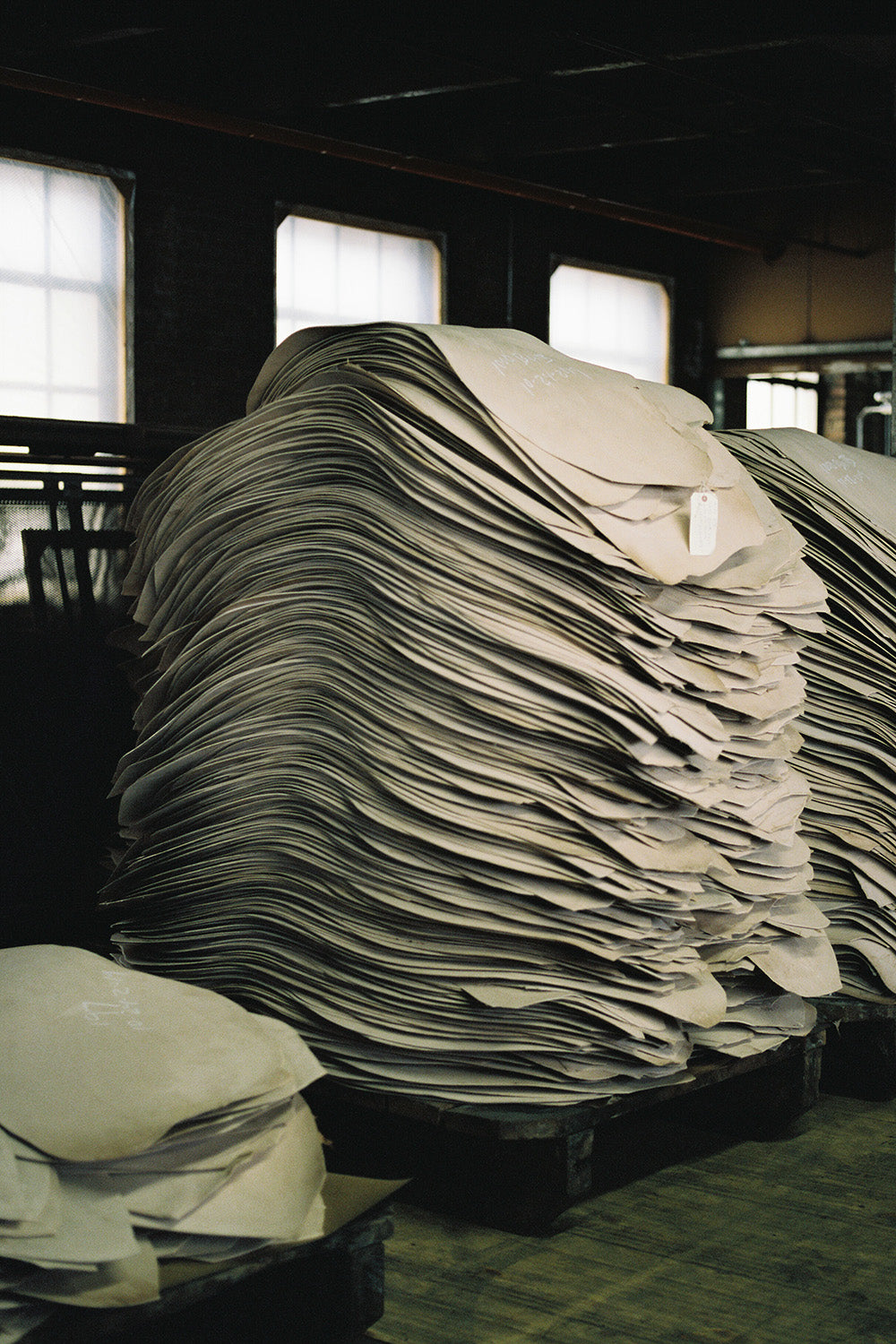 Untanned leather hides lay in large piles.