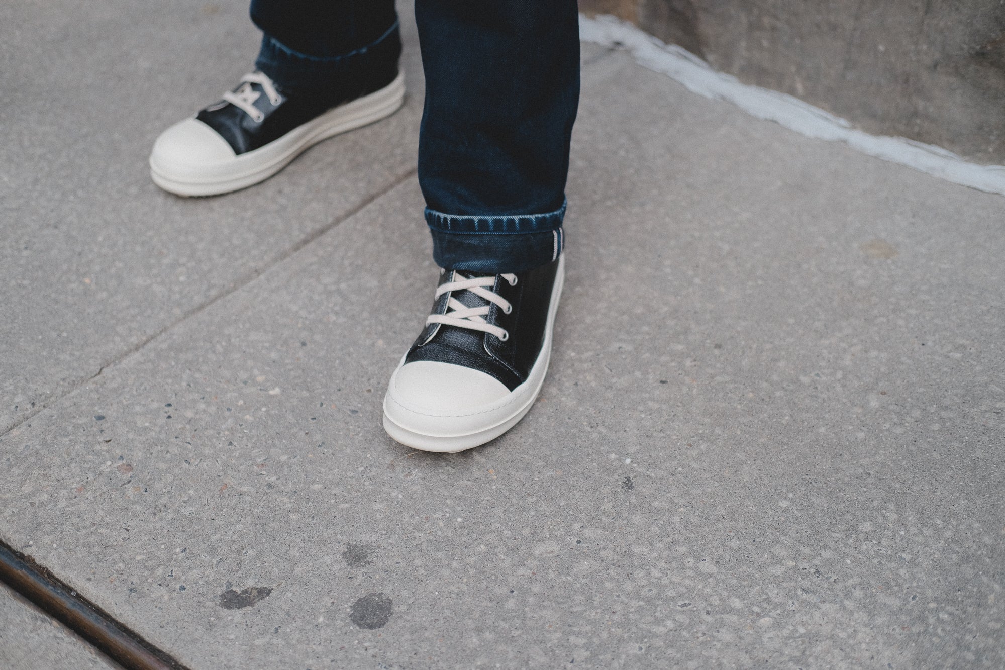 A pair of black Rick Owens Ramones sneakers.