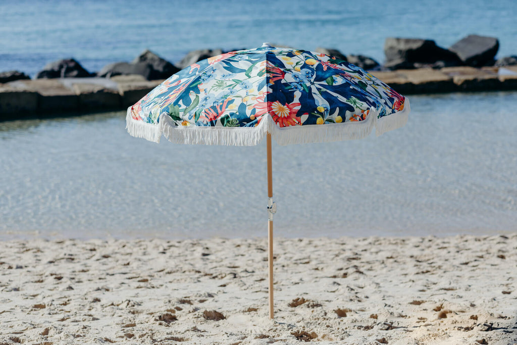 Field Day Beach Umbrella featuring native botanicals blues greens and red
