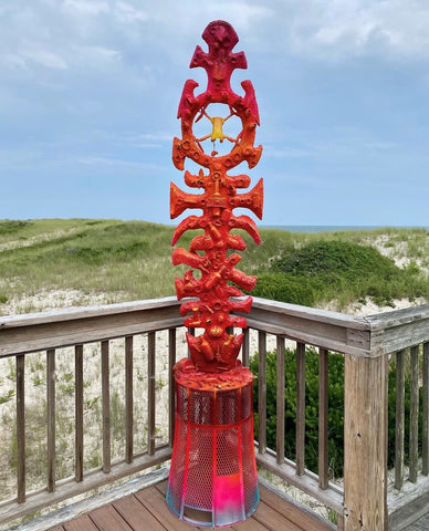 surf totem by Gregory de la Haba in ombre red at the beach in Southampton NY