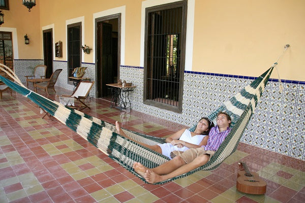 Couple resting in Mexican Hammock