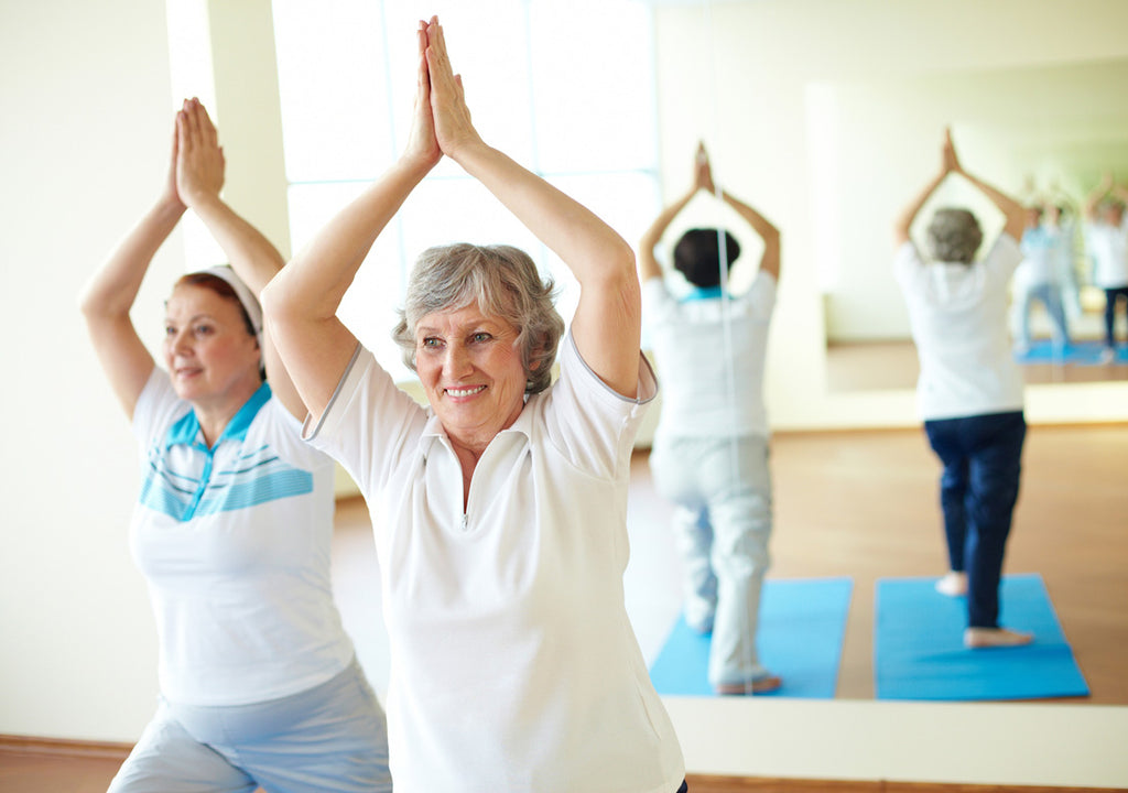 Image of older women doing yoga to stay active as a natural stress relief remedy