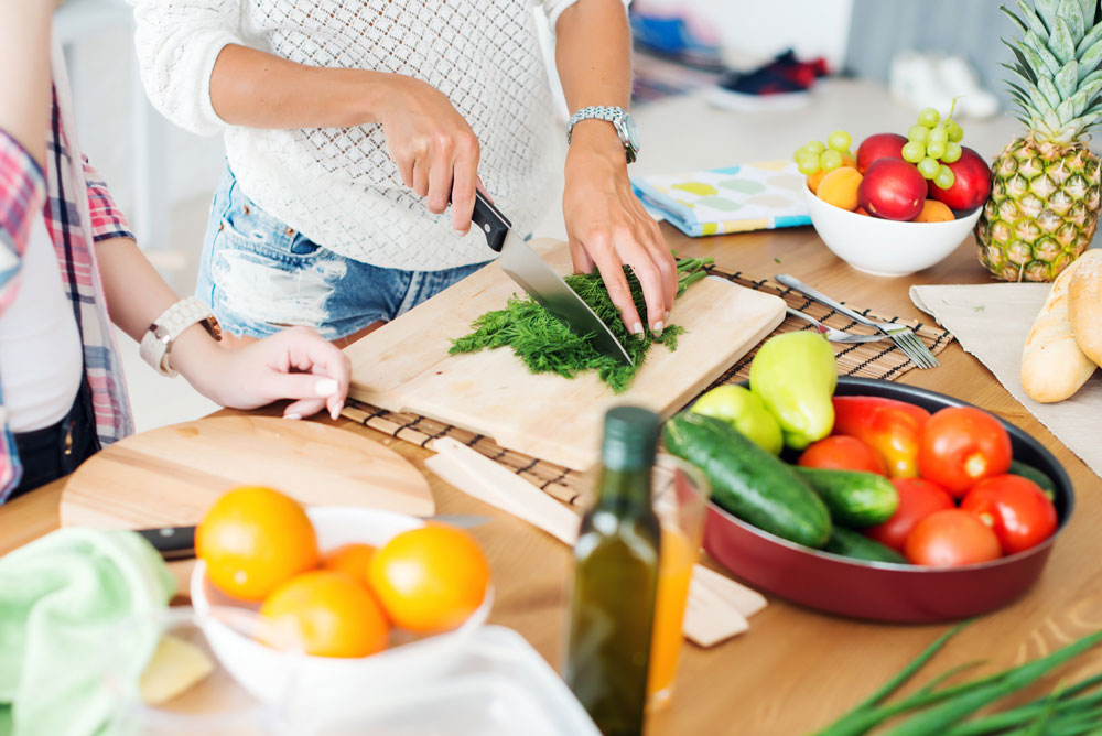 Image of two women preparing a healthy meal