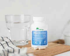 bluebiotics ultimate care probiotics with glass of water