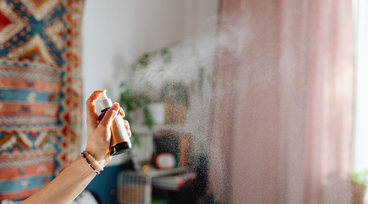 spraying bottle with mist coming out