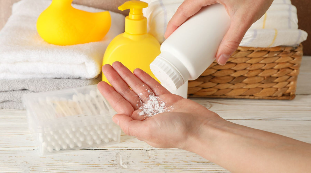 shaking baby powder out of bottle