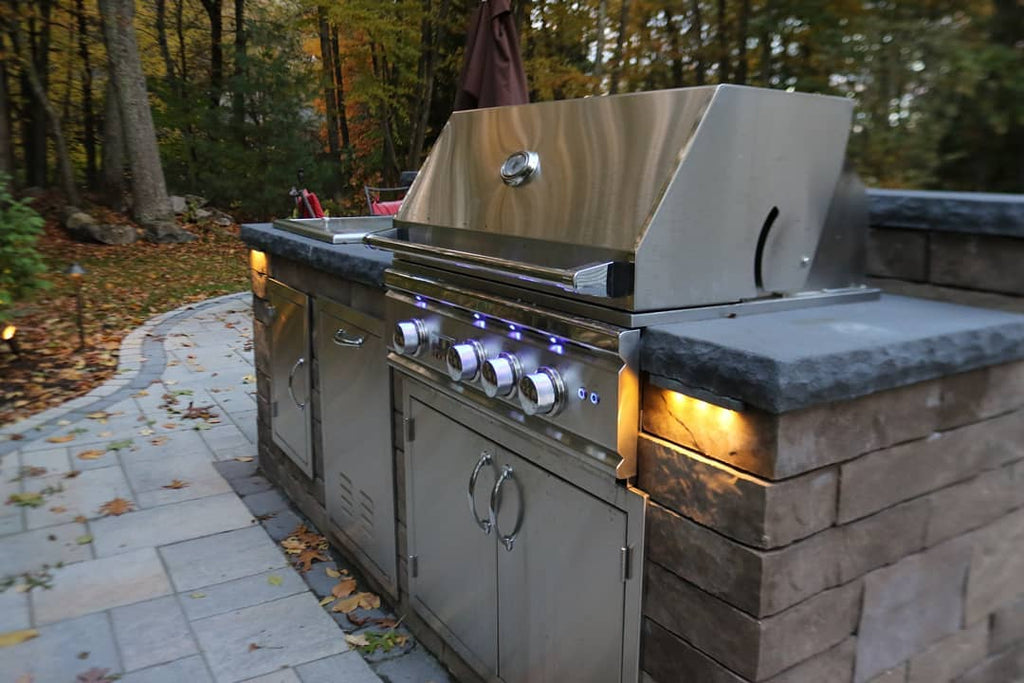 Chisel cut counters add a rustic touch to this outdoor kitchen