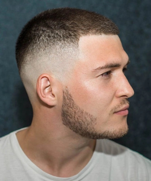 Crop buzz cut with even top and faded sides for a neat, low-maintenance style.