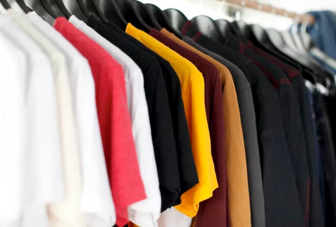 clothing rack of different color vneck tees for men