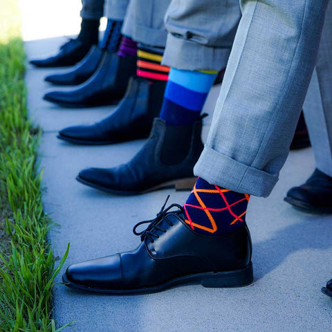 men wearing colorful patterned dress socks