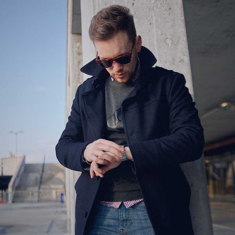 man wearing jeans and trench coat with dress shirt