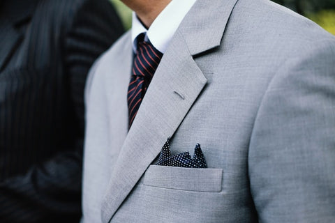 light gray suit with white shirt and tie