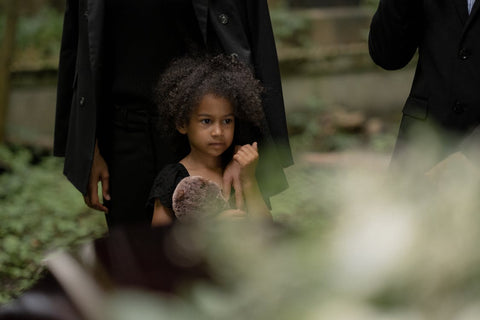 child at funeral