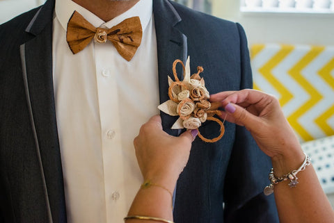 pinning a Boutonniere on jacket