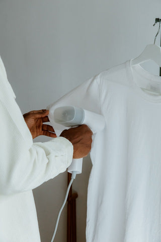 steaming a white t shirt for the office