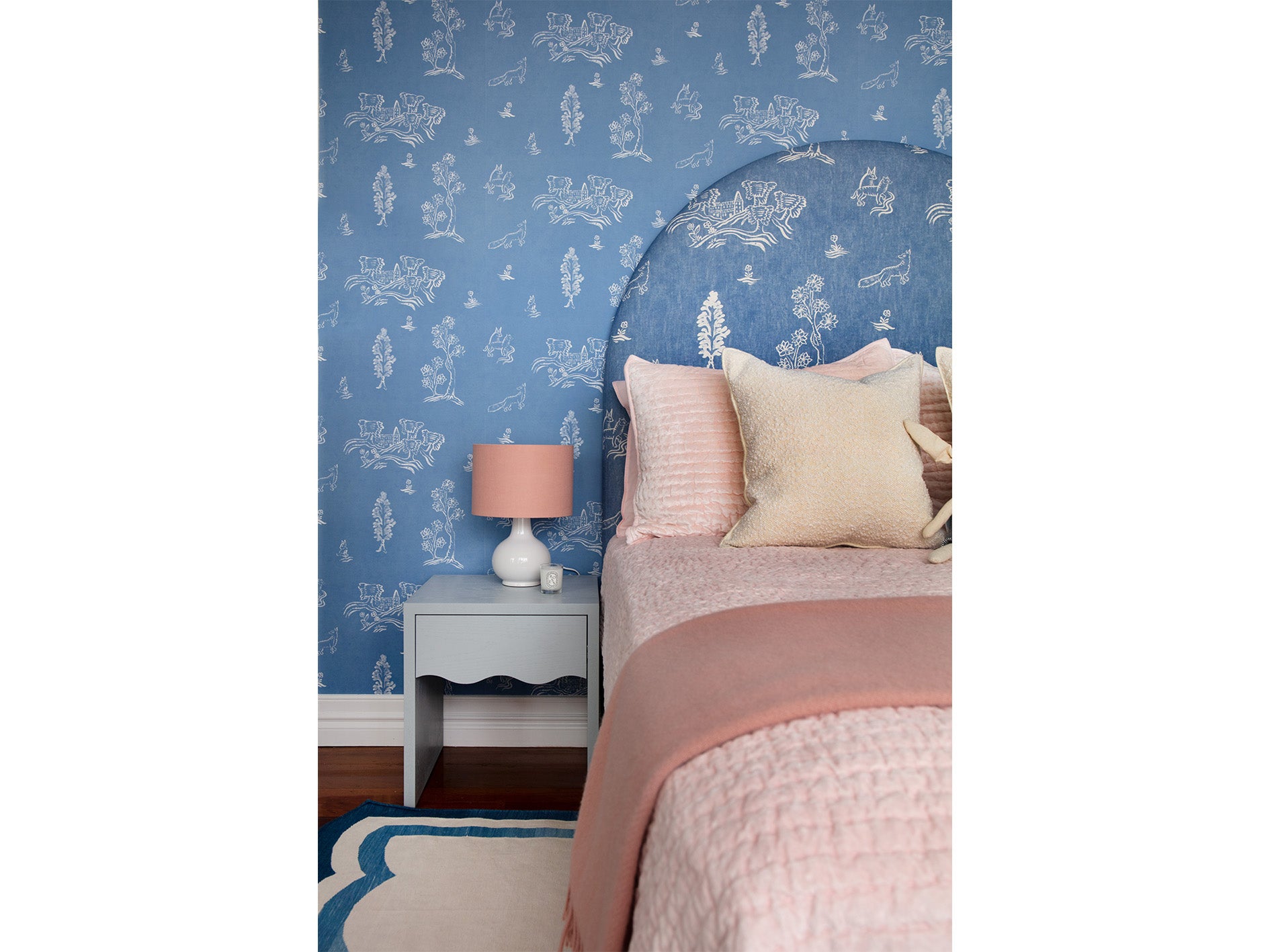 Little Girls Bedroom with Blue Wallpaper and Pink Bedding