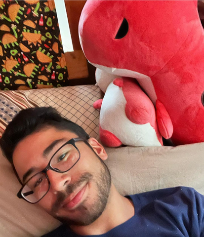 man in bed with stuffed animal