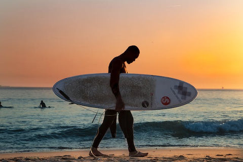 surfer enjoying beautiful sunset