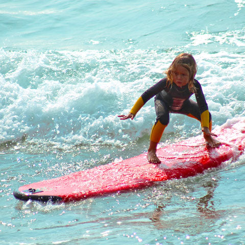 kid on surf board