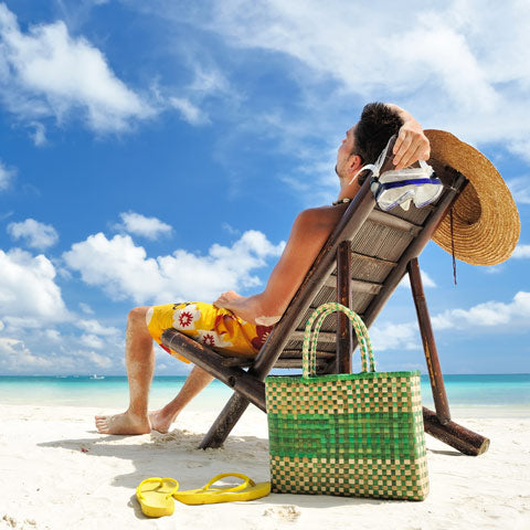 man on the beach with flip flop shoes