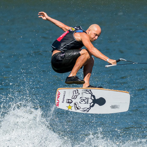 man wears shoes for wakeskate jump