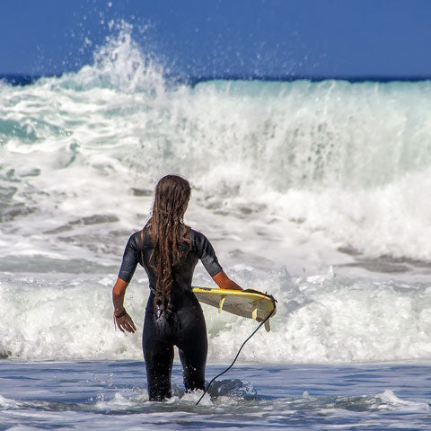 lady surfer wearing wetsuit - sale