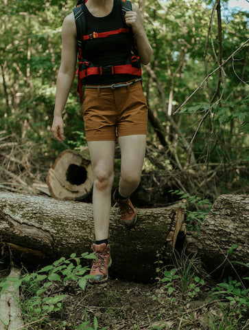 woman hiking with a backpack in summer 