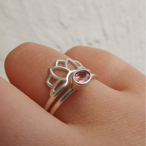 Pink peach sapphire silver lotus ring on hand