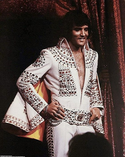 Elvis Presley in his iconic bejeweled white jumpsuit