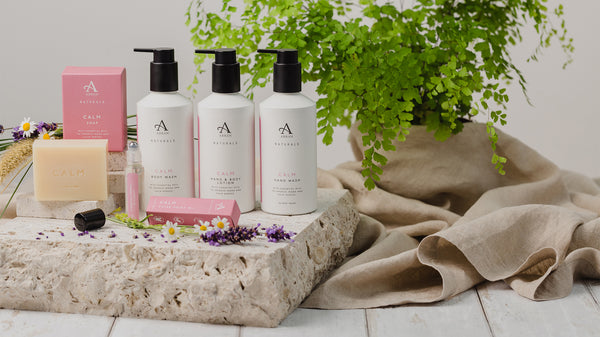 Image shows ARRAN Naturals Calm Collection with Soap, Pulse Point Oil Rollerball, Shower Gel, Hand Wash and Hand & Body Lotion