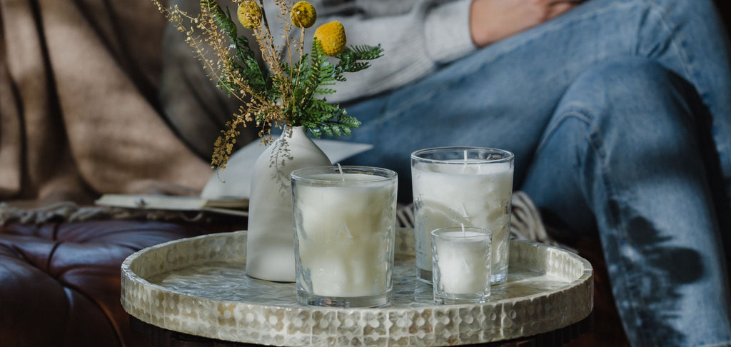 Image of scented candles on table in lounge