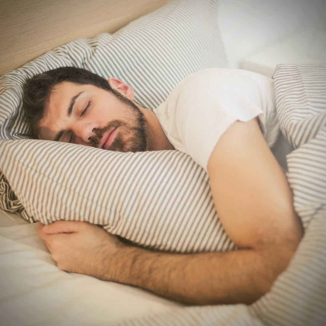 Man asleep on bed