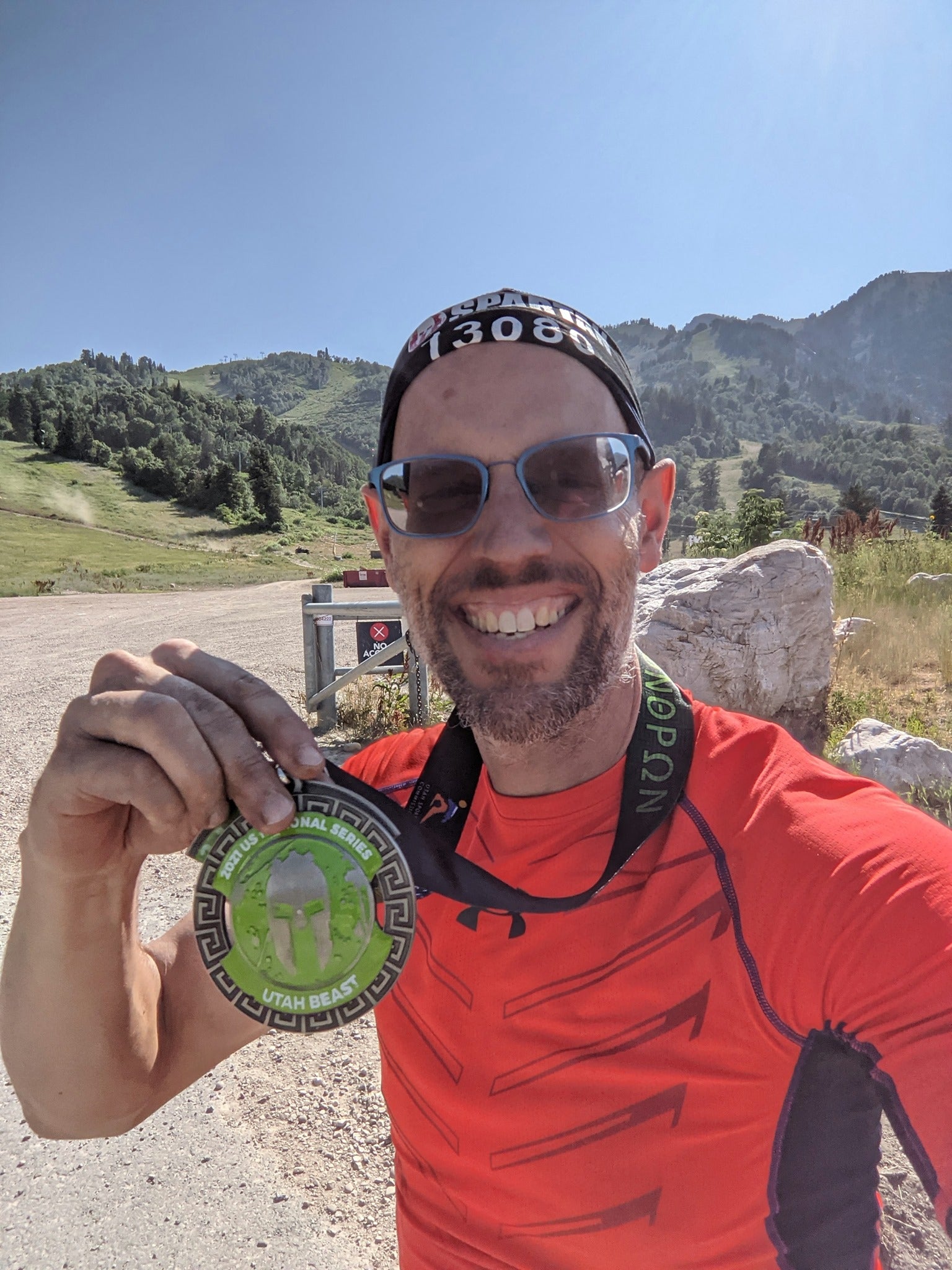 Mark, the owner of HEALTHandMED.com showing his medal after running a race